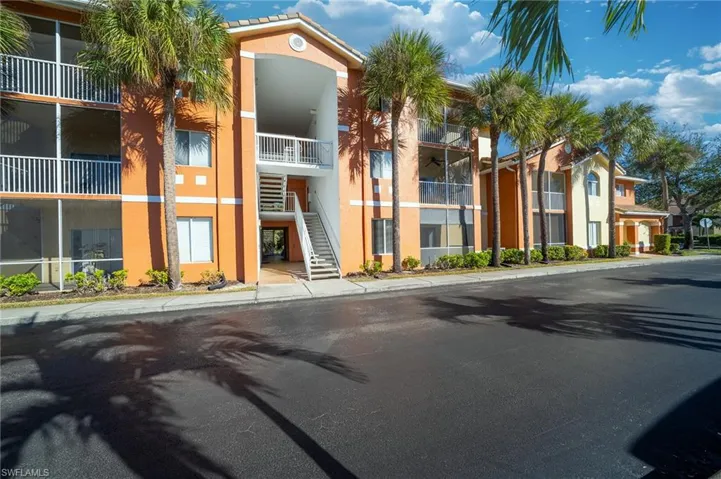 View of apartment building / complex featuring stairs