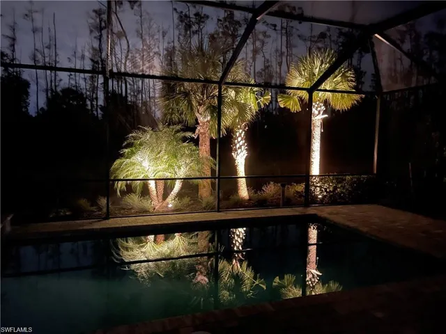 View of pool featuring a lanai