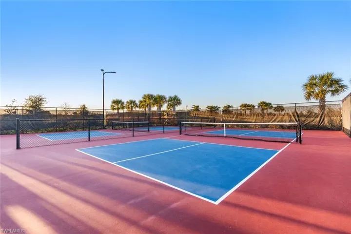 View of tennis court with basketball court