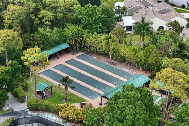 Bocce ball courts featuring multiple playing lanes and shaded seating areas