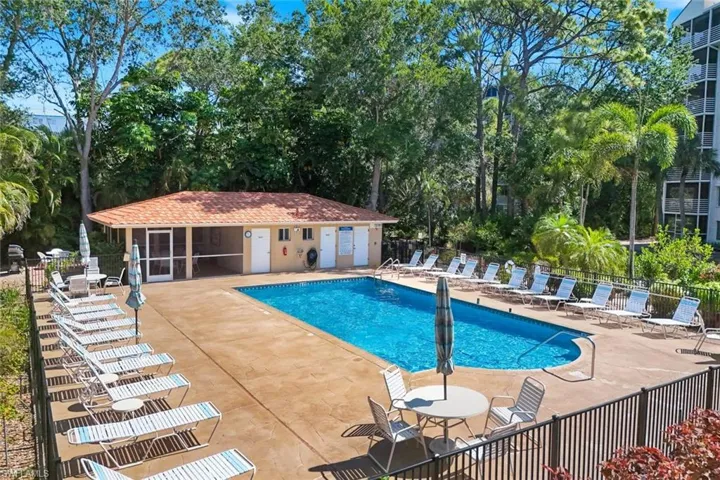 Rectangular swimming pool surrounded by a concrete deck