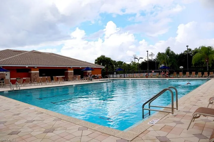 Community pool featuring a patio