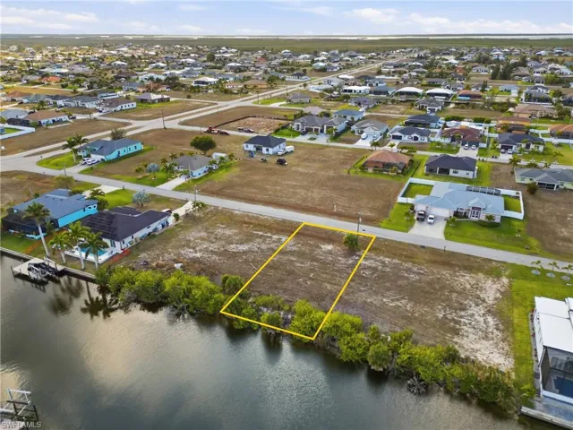 Aerial view of residential area with property parcel outlined