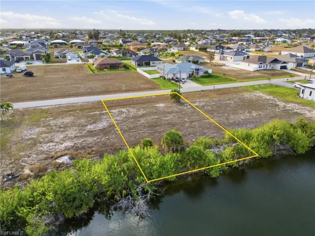 Aerial view of residential area with property parcel outlined