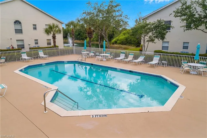 View of pool featuring a patio area and fence