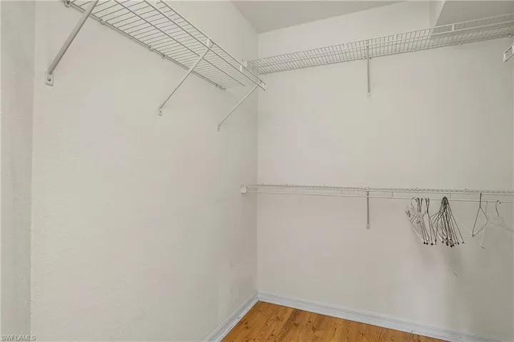 Walk in closet featuring light wood finished floors
