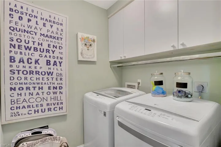 Laundry area featuring cabinets and independent washer and dryer