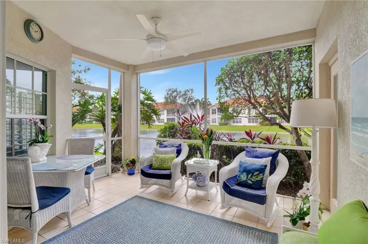 Sunroom featuring plenty of natural light, ceiling fan, and a water view