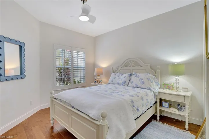 Bedroom 1 featuring ceiling fan and hardwood / wood-style flooring