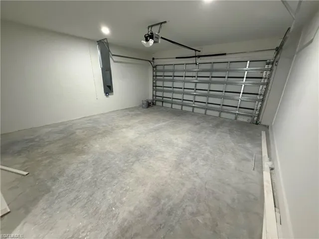 Garage featuring a garage door opener