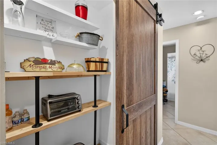 Detailed view of a barn door and baseboards