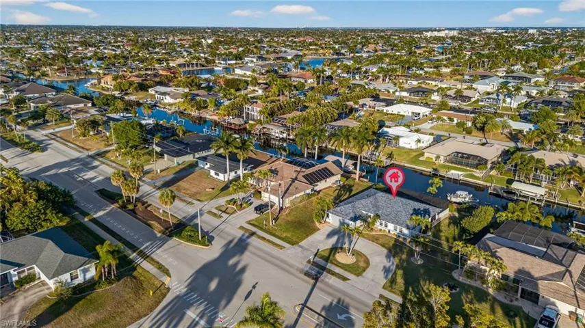Aerial perspective of suburban area with a nearby body of water