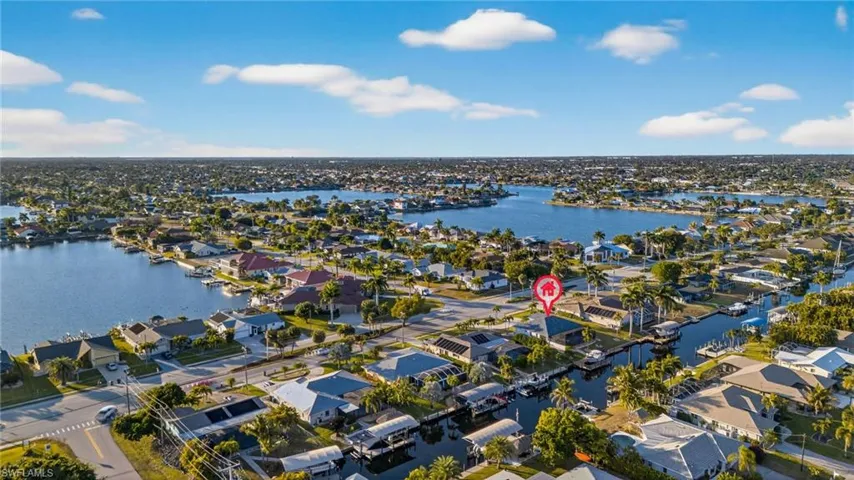 Aerial view of residential area with a large body of water