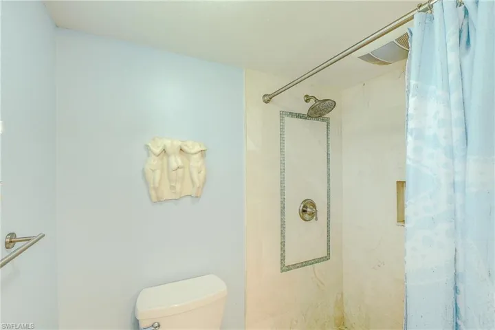 Full bath featuring a shower stall