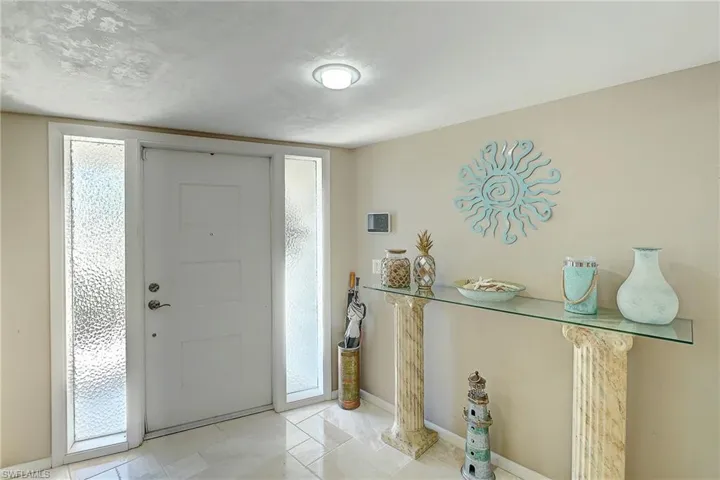 Entrance foyer featuring baseboards