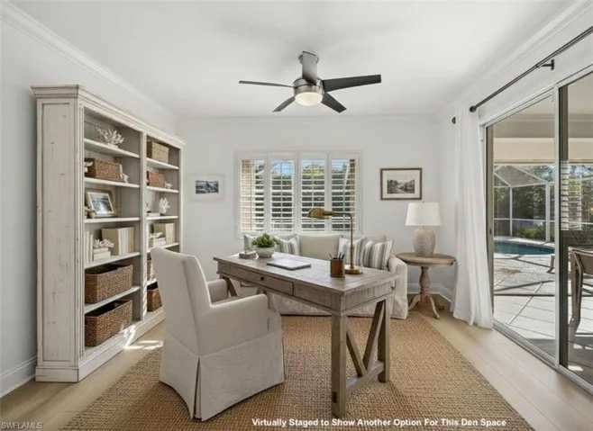 Office area featuring ornamental molding, ceiling fan, and light wood-style floors