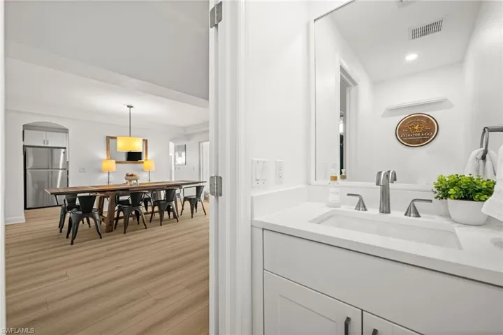 Bathroom featuring vanity and light wood-type flooring
