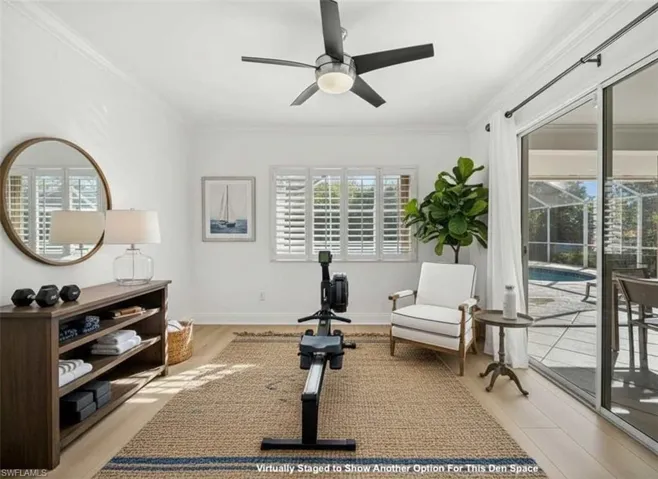 Workout room with ceiling fan, crown molding, light wood finished floors, and a sunroom