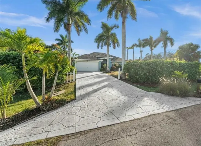 View of front of home featuring driveway and an attached garage