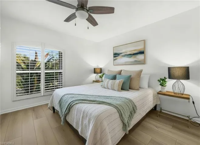 Bedroom with light wood finished floors and ceiling fan