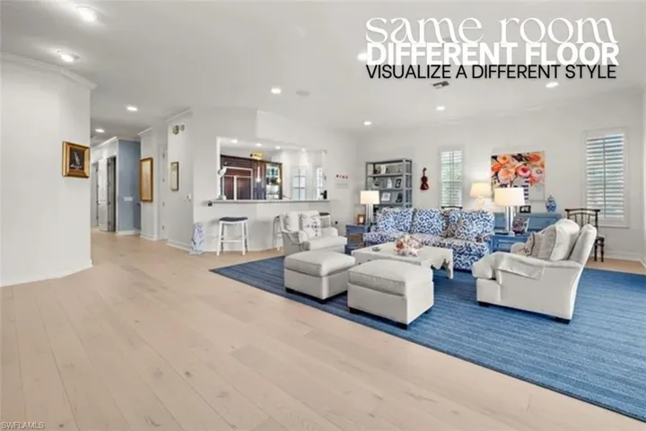 Living room with hardwood / wood-style floors and recessed lighting