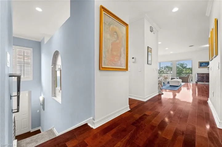Hall with recessed lighting, dark wood finished floors, and crown molding