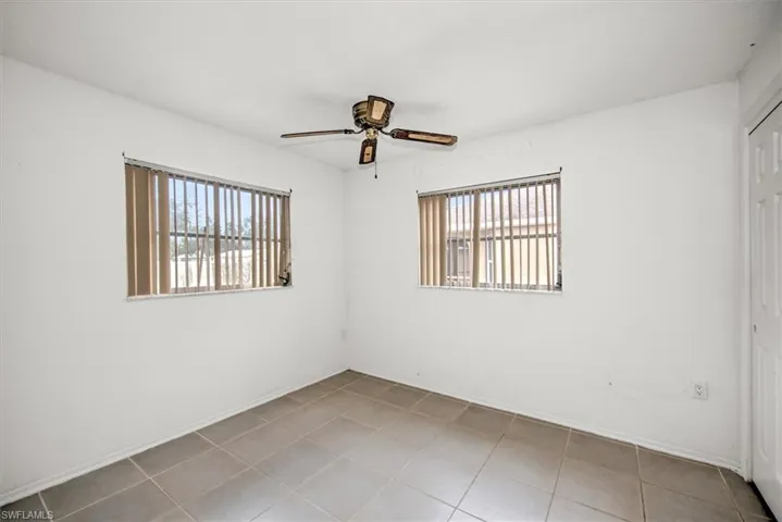 Spare room with ceiling fan