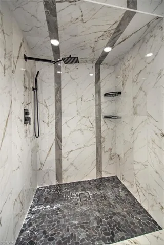 Bathroom featuring tiled shower