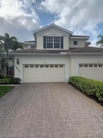 View of property with a garage