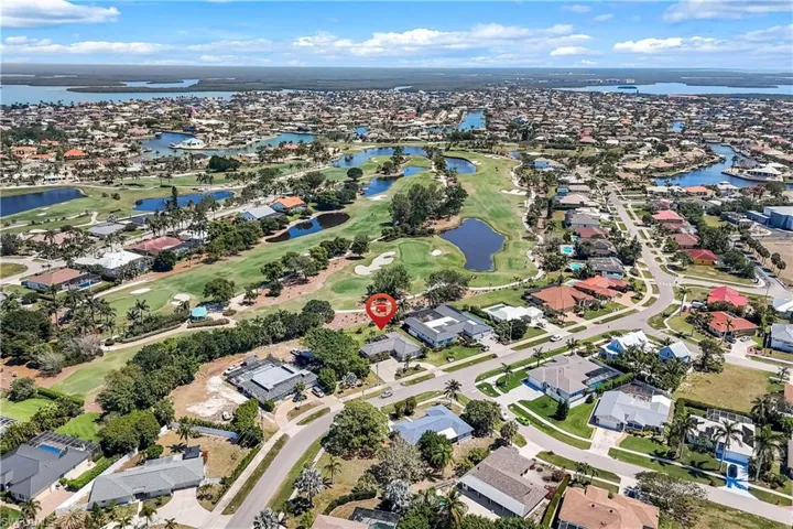 Bird's eye view with a water view, a residential view, and view of golf course.