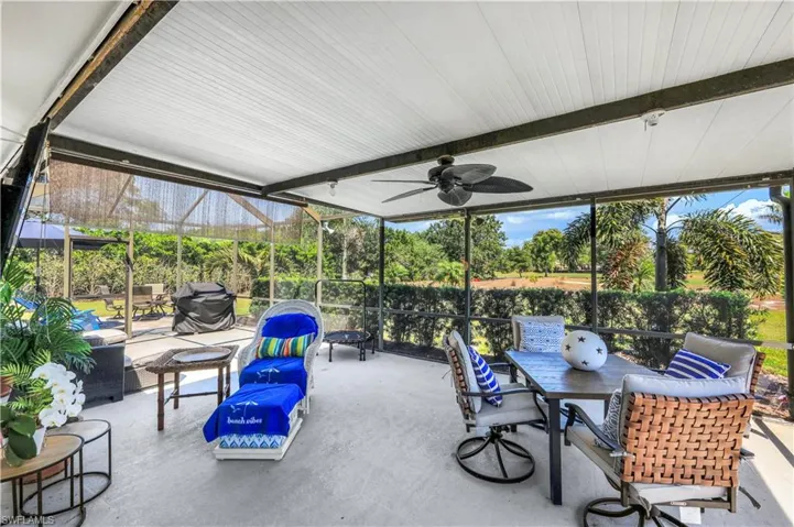 View of patio / terrace featuring area for grilling, a ceiling fan, and outdoor dining space.