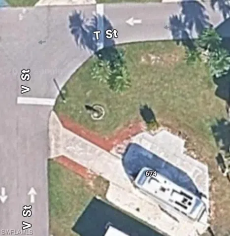 Aerial view of overside lot with lots of open green space.