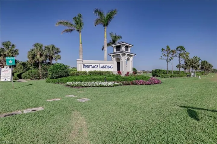 Community / neighborhood sign with a lawn