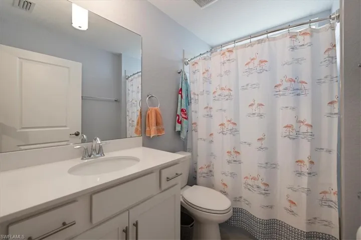 Bathroom featuring vanity and a shower with curtain
