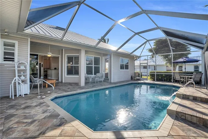 Large lanaii with extra space for seating and dining and access to bathroom