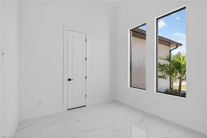 Den with windows and a small closet, can be converted into a small bedroom or office