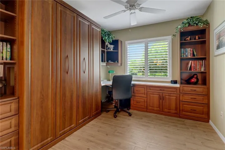 Office space featuring light hardwood / wood-style floors and ceiling fan