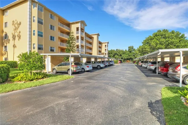 View of parking with a carport