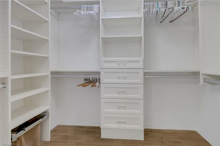 Walk in closet featuring light hardwood / wood-style flooring