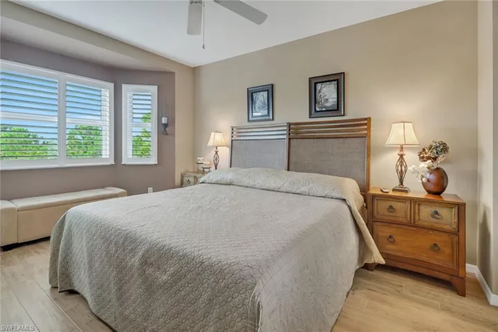 Bedroom featuring light hardwood / wood-style floors and ceiling fan