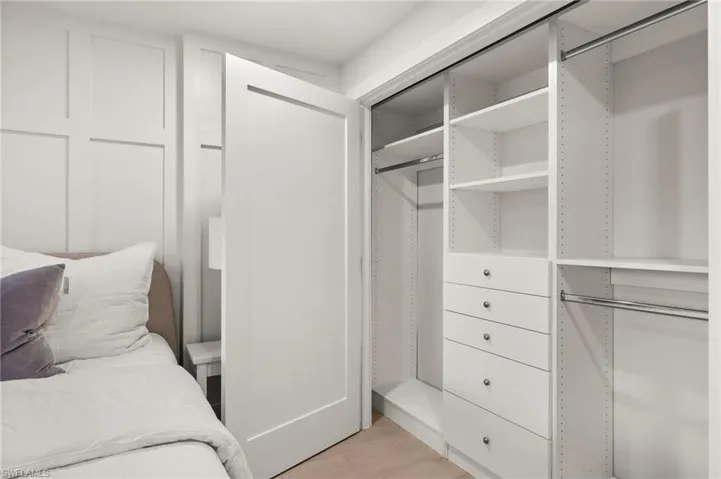 Custom-built closet with ample storage and sleek modern design