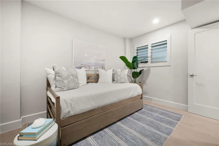 Serene bedrooms with custom closet systems and plantation shutters for a polished touch.