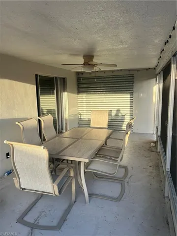 View of patio / terrace featuring ceiling fan and outdoor dining space