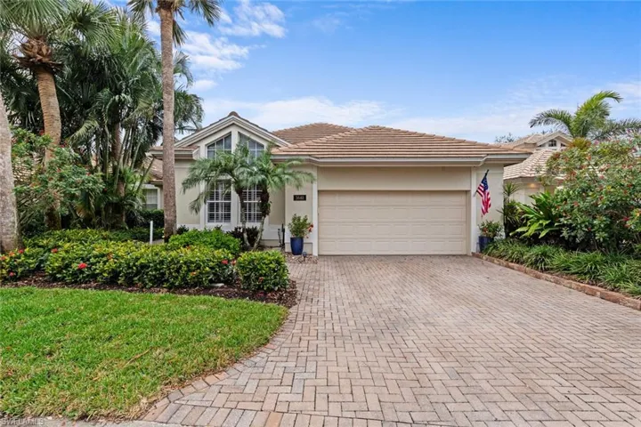 View of front of property with a garage