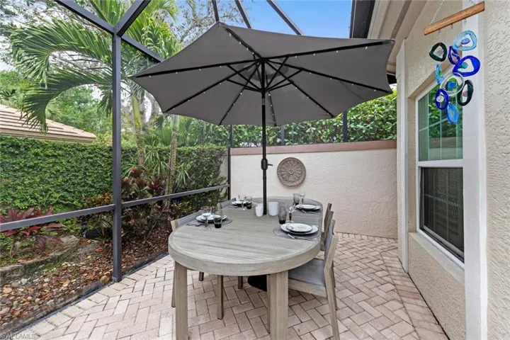 View of patio / terrace featuring glass enclosure