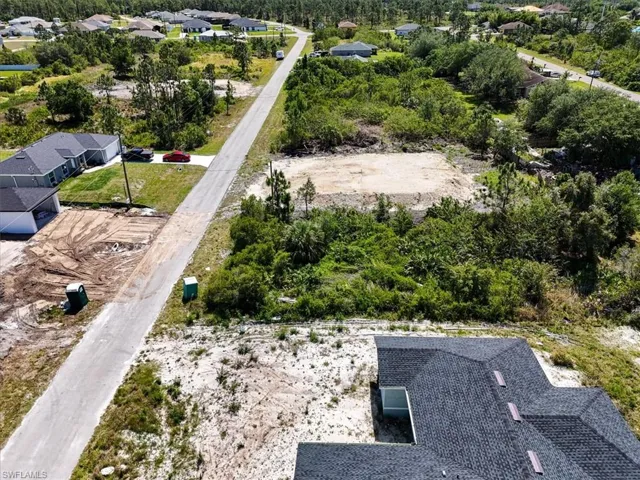 Birds eye view of property with a residential view