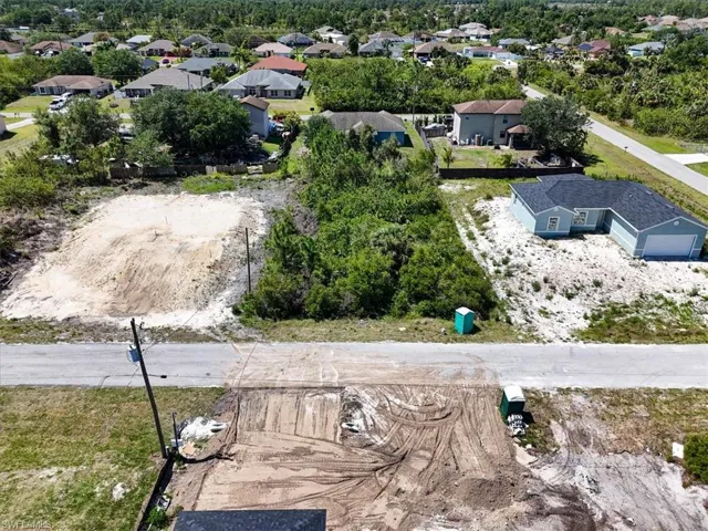 Birds eye view of property with a residential view