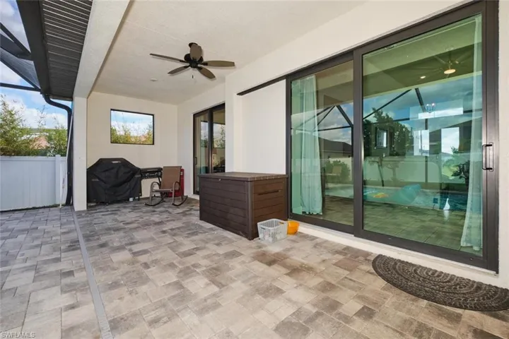 View of patio featuring grilling area and ceiling fan