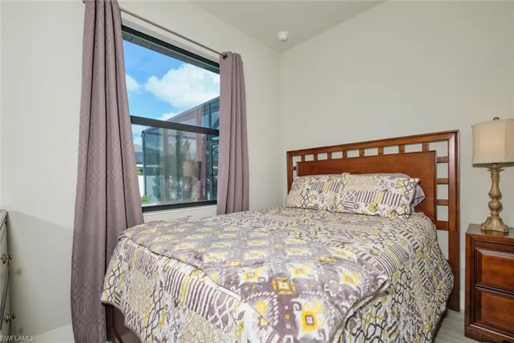 Bedrood # 3 with wood look tile flooring and ceiling fan