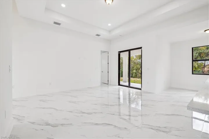 Spare room with a tray ceiling